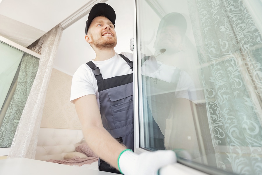 worker installing double glazed window