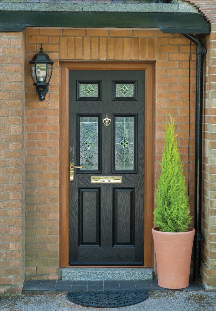 a black composite door on a brick house