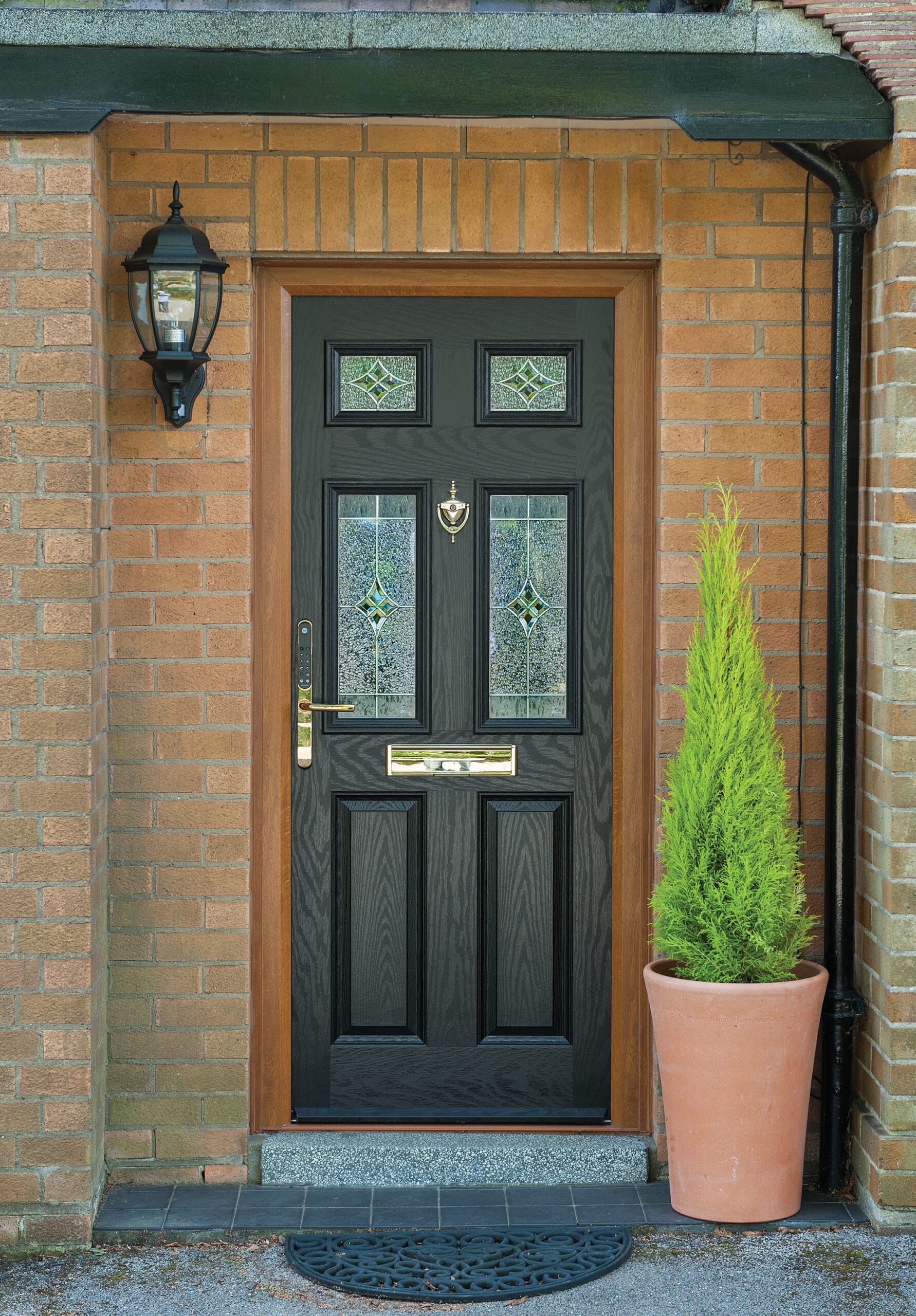 a black composite door on a brick house